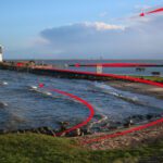A red line is drawn across the water.