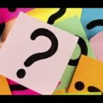 A bunch of different colored paper with question marks on it