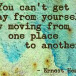 A quote by ernest hemmingway on the side of a wall.