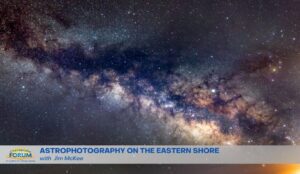 A picture of the night sky with stars and clouds.